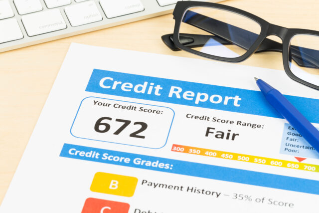 Fair credit score report with pen and keyboard; document