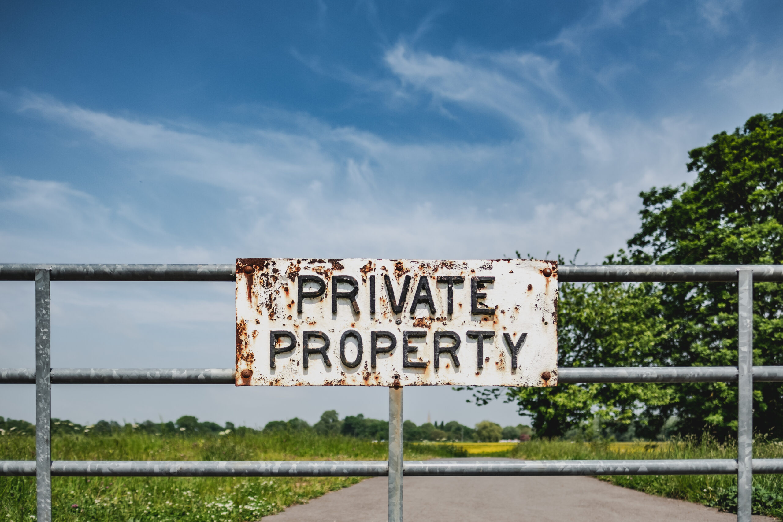 Private Property sign seen attached to a farm gate, warning members of the public not to enter the meadow