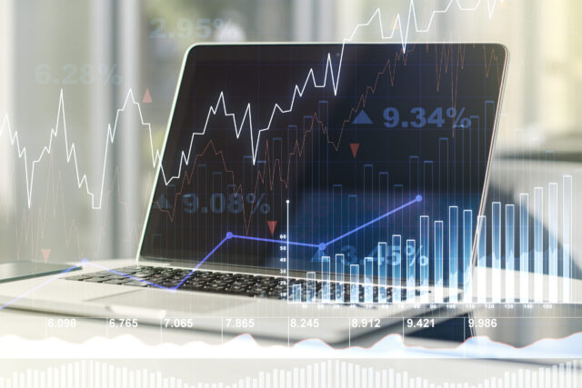 Abstract creative financial graph on modern laptop background, financial and trading concept. Multiexposure