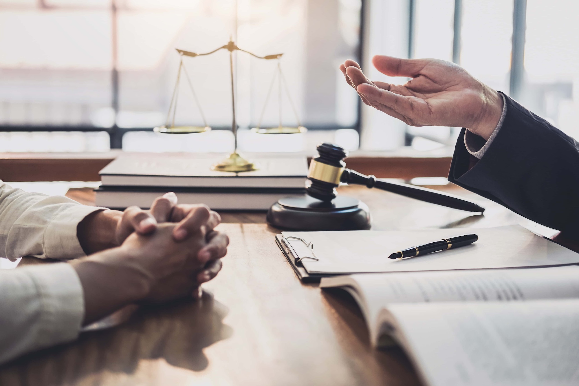 Consultation and conference of professional businesswoman and Male lawyers working and discussion having at law firm in office. Concepts of law Judge gavel with scales of justice
