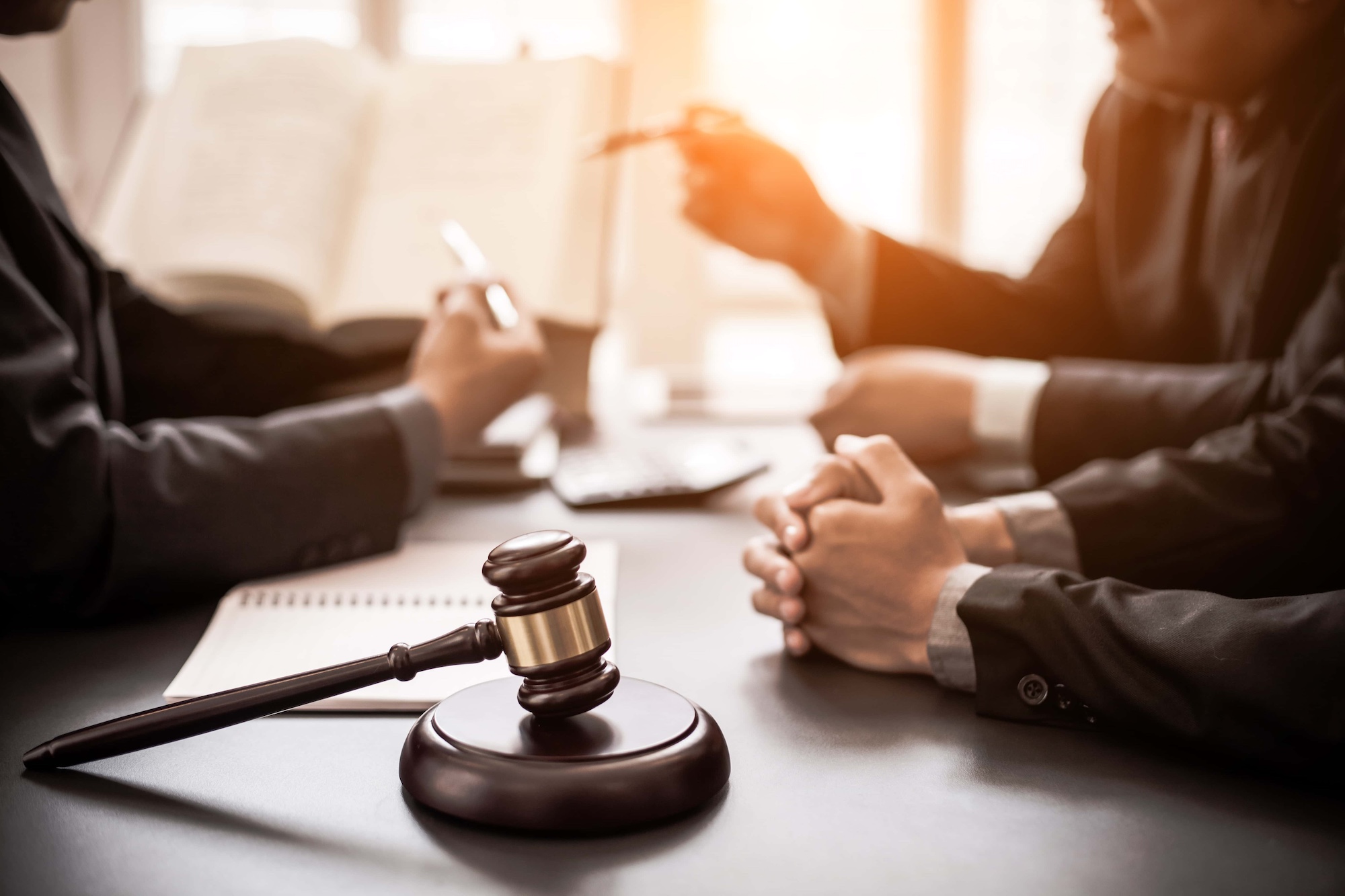 Group of business people and lawyers discussing contract papers Consultation between a male lawyer and businessman concept