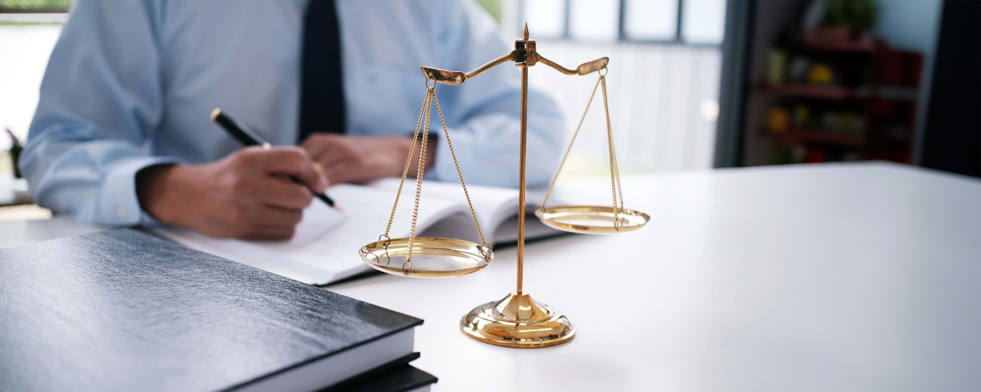 Legal counsel presents to the client a signed contract with gavel and legal law. justice and lawyer concept