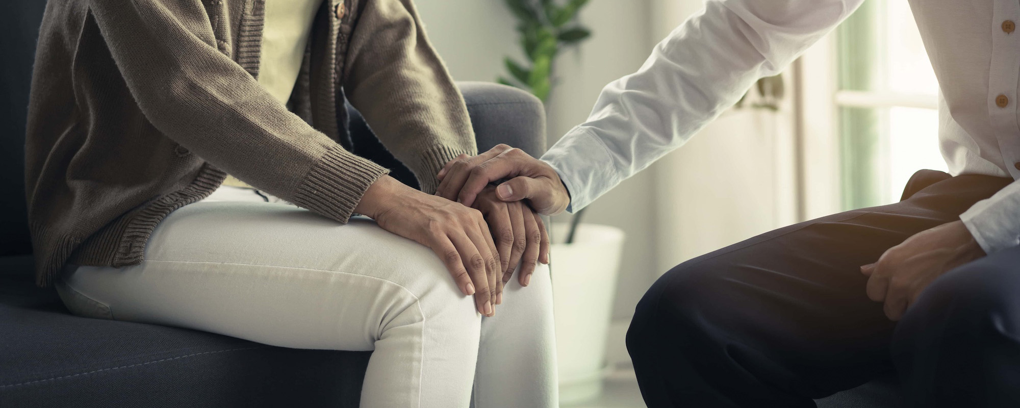 Stressed asian patient talking with personal psychologist in therapist session have a and doctor touching her hand feel empathy