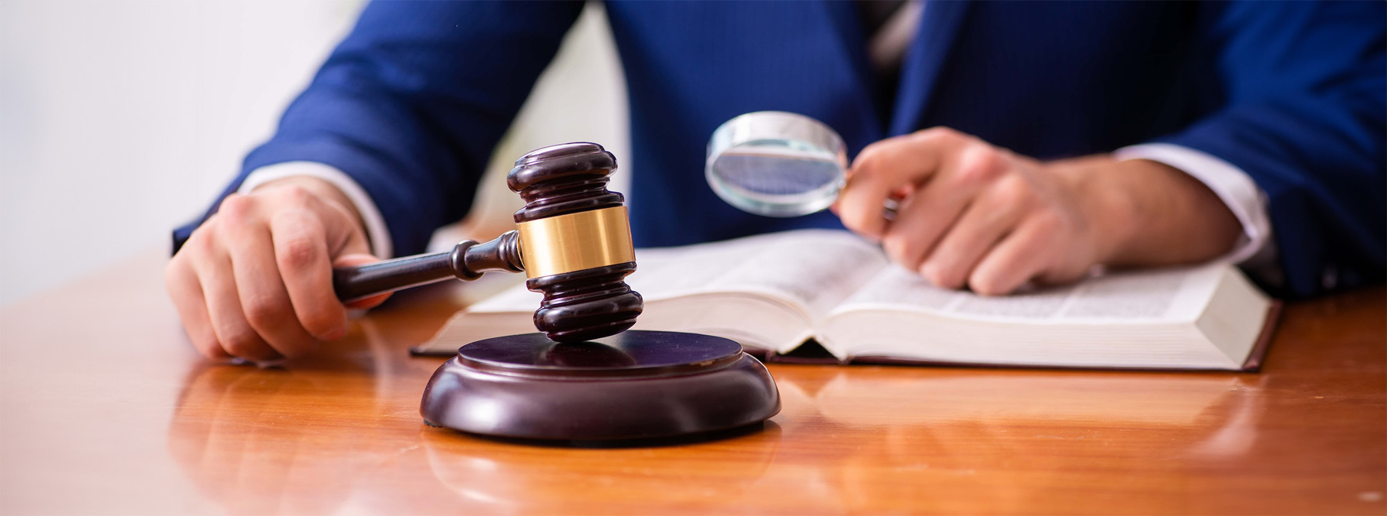 Young male judge sitting in courtroom