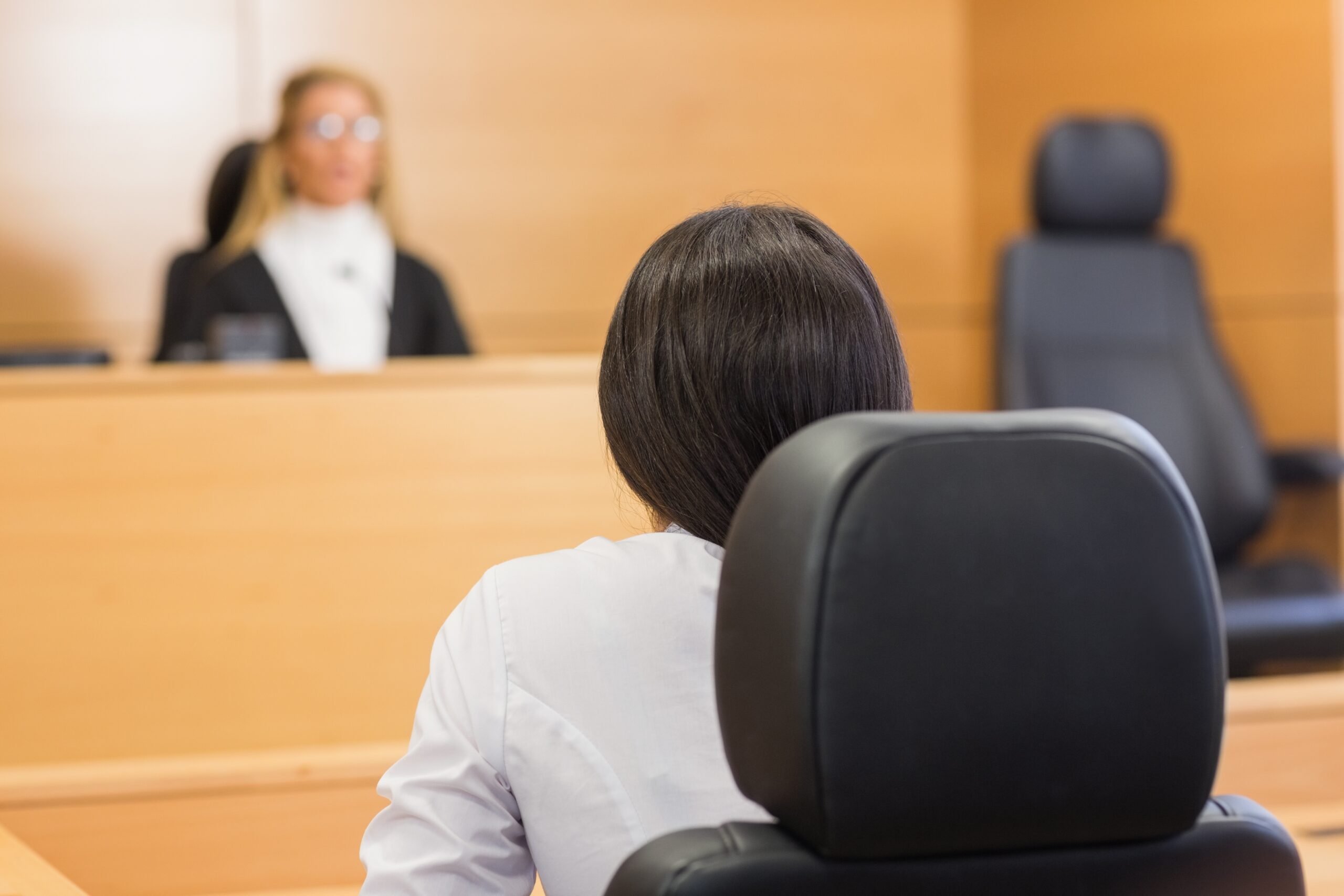 woman at court hearing in front of judge