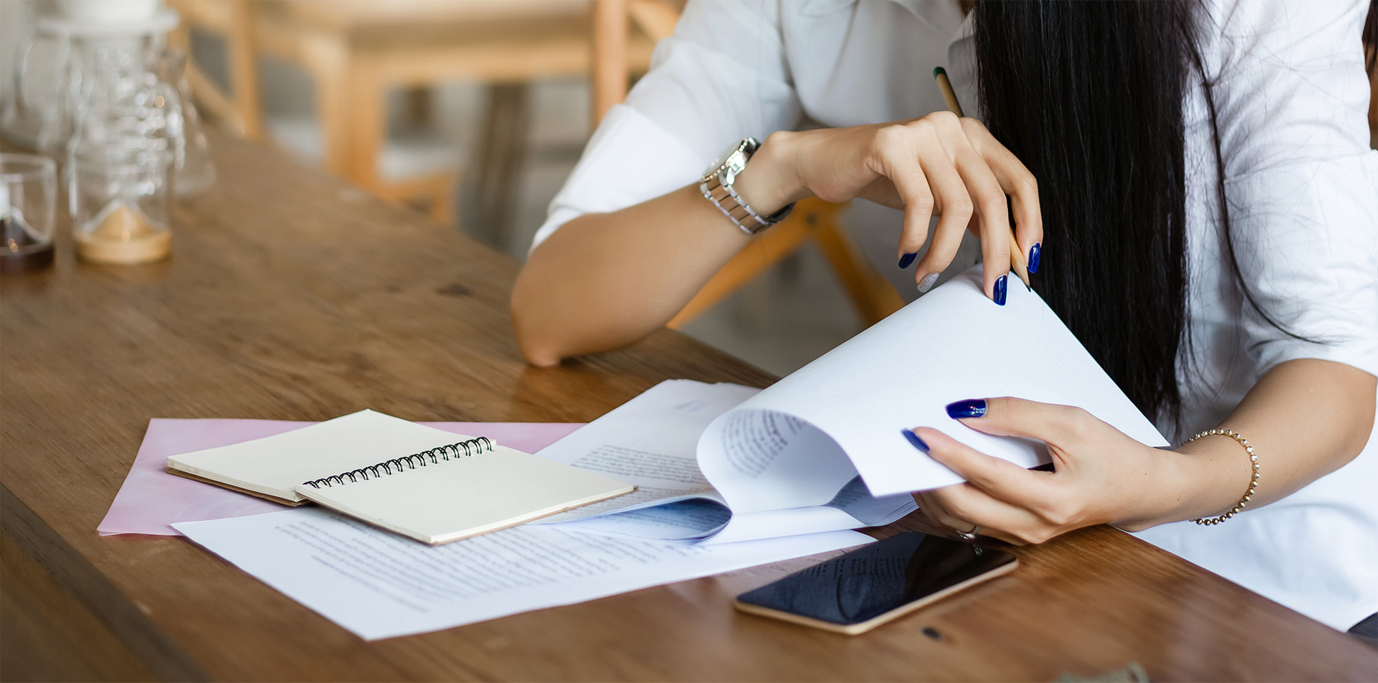 Young businesswoman looking and read information from paperwork