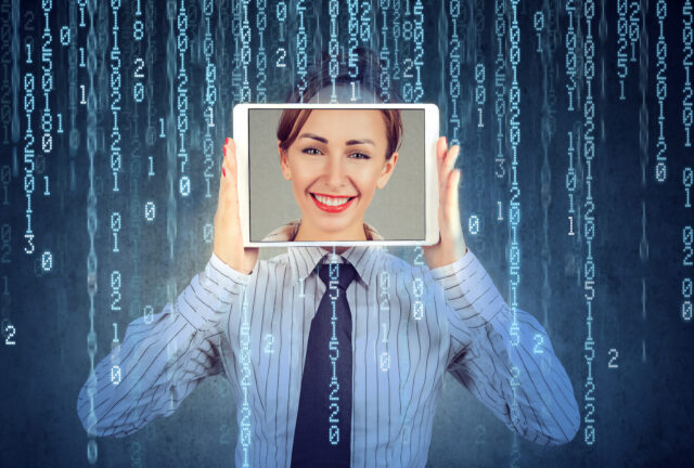 person holding a screen up to their face isolated on binary code identity theft concept